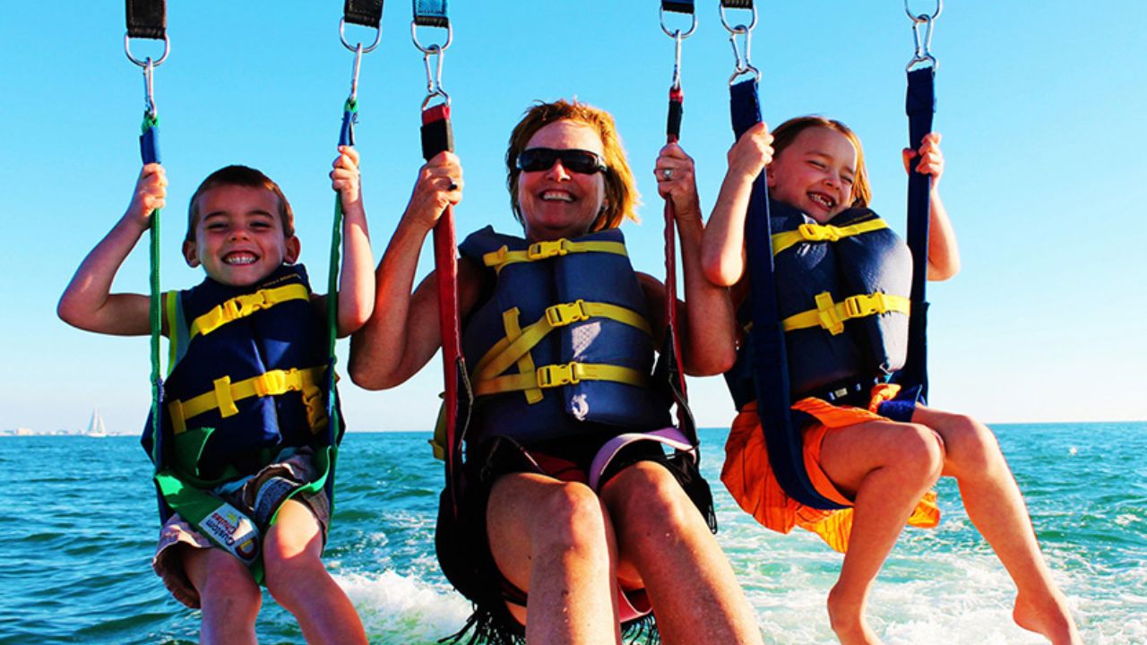 Kids and seniors parasailing safely while enjoying the moment in the sky.