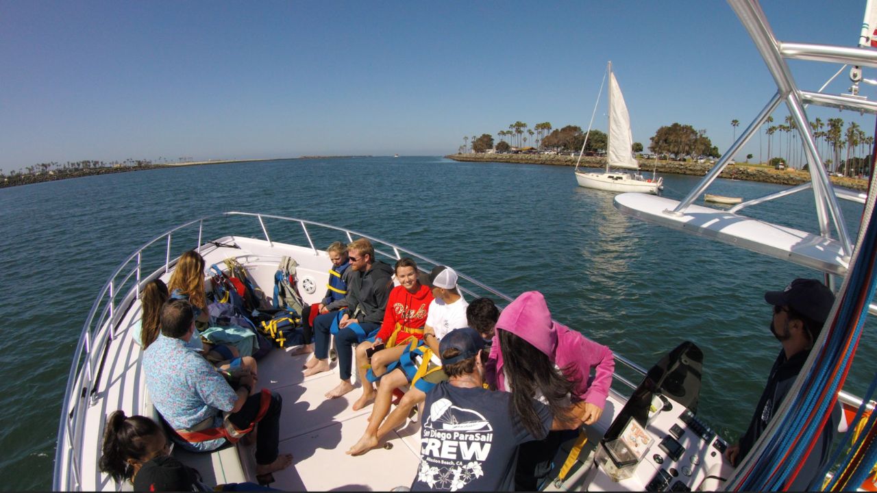 Guests relaxing on a parasail boat before takeoff in Mission Bay San Diego