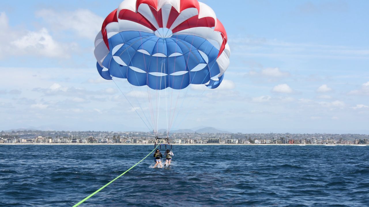 Tandem parasailing adventure over the Pacific Ocean