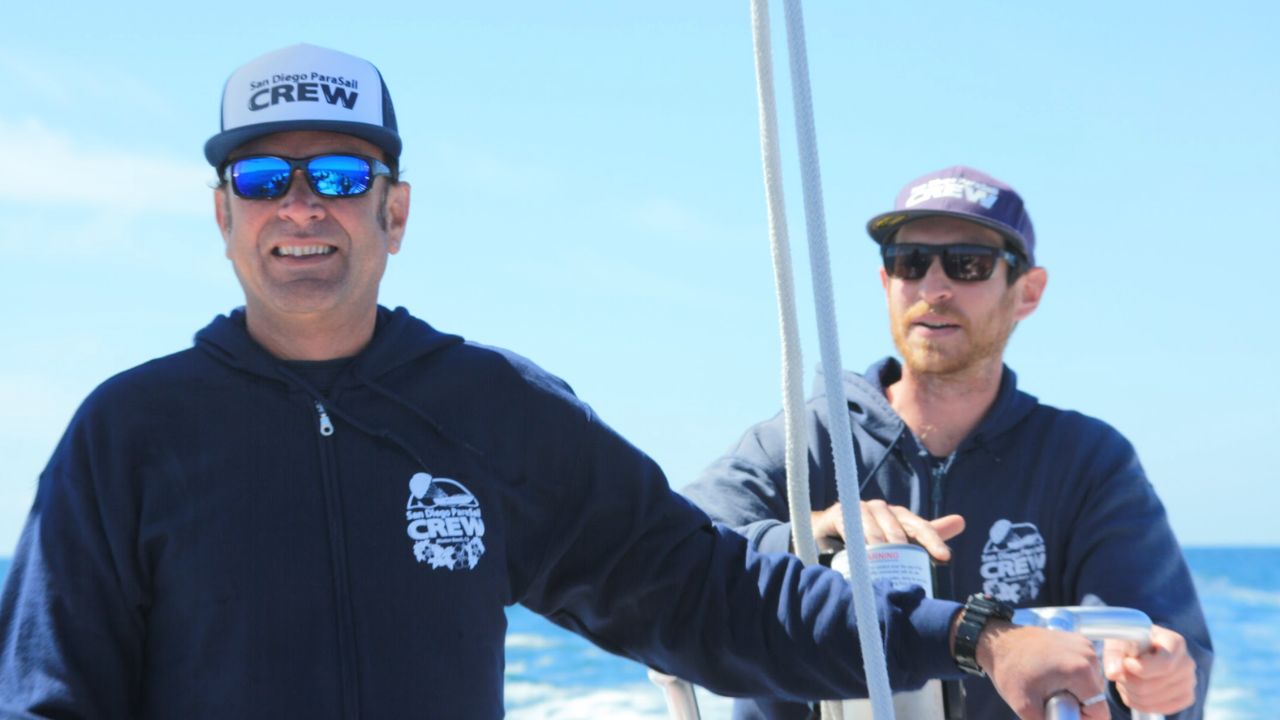 Professional Go Parasailing crew members ensure a safe and memorable experience.