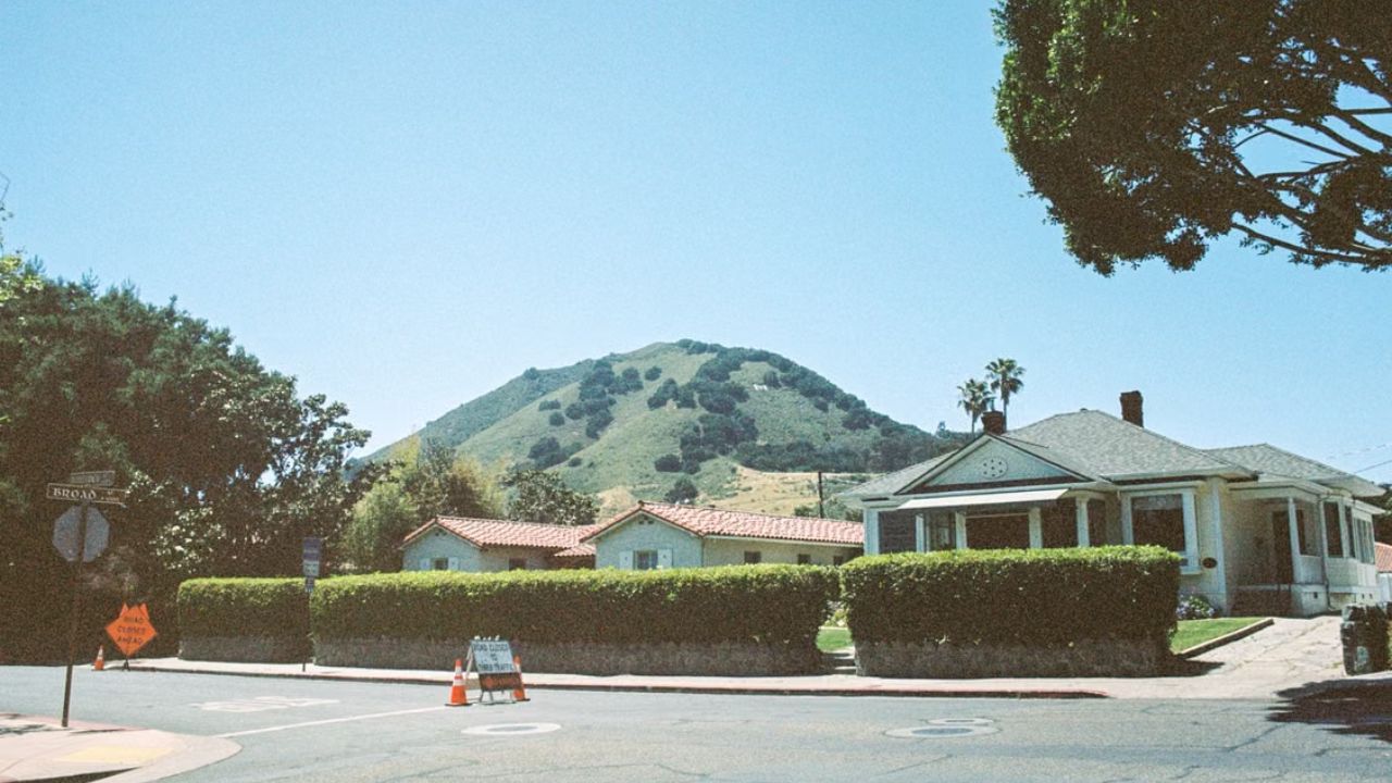 Quiet residential neighborhood with hillside views in San Luis Obispo, California, on a sunny day. 