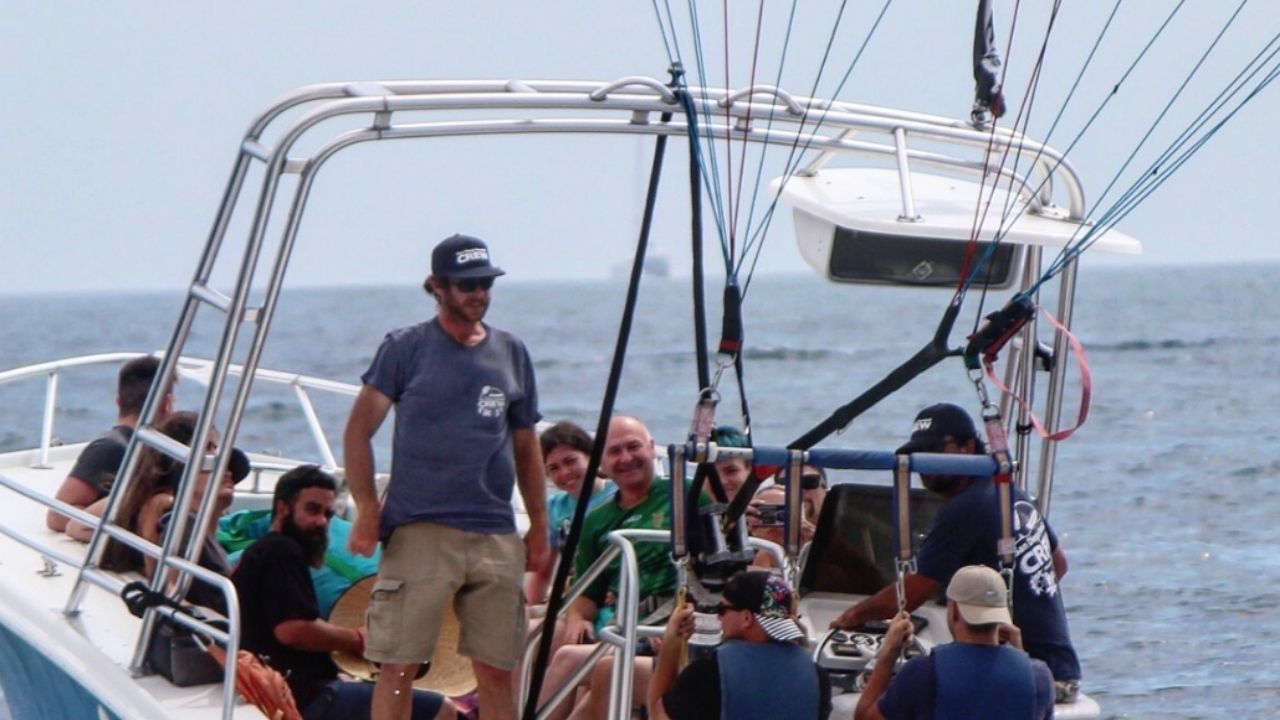 Guests preparing for a parasailing adventure aboard a boat in San Diego.